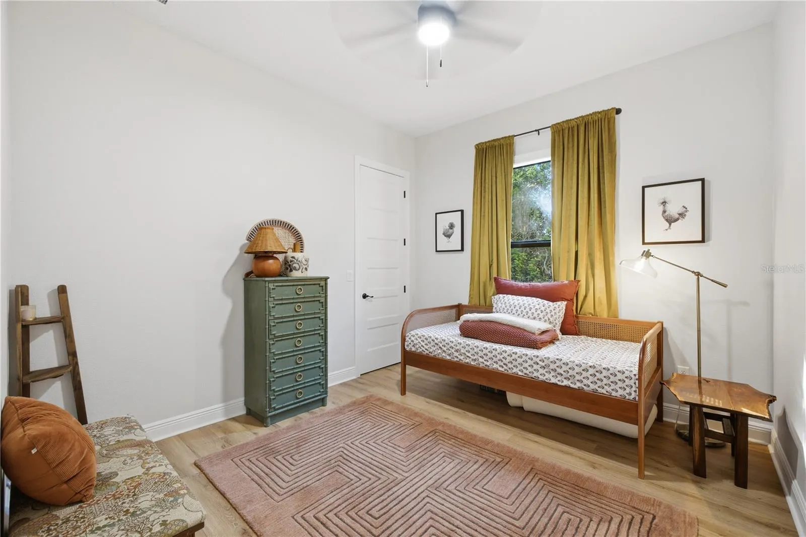Bedroom number three with large walk-in closet.