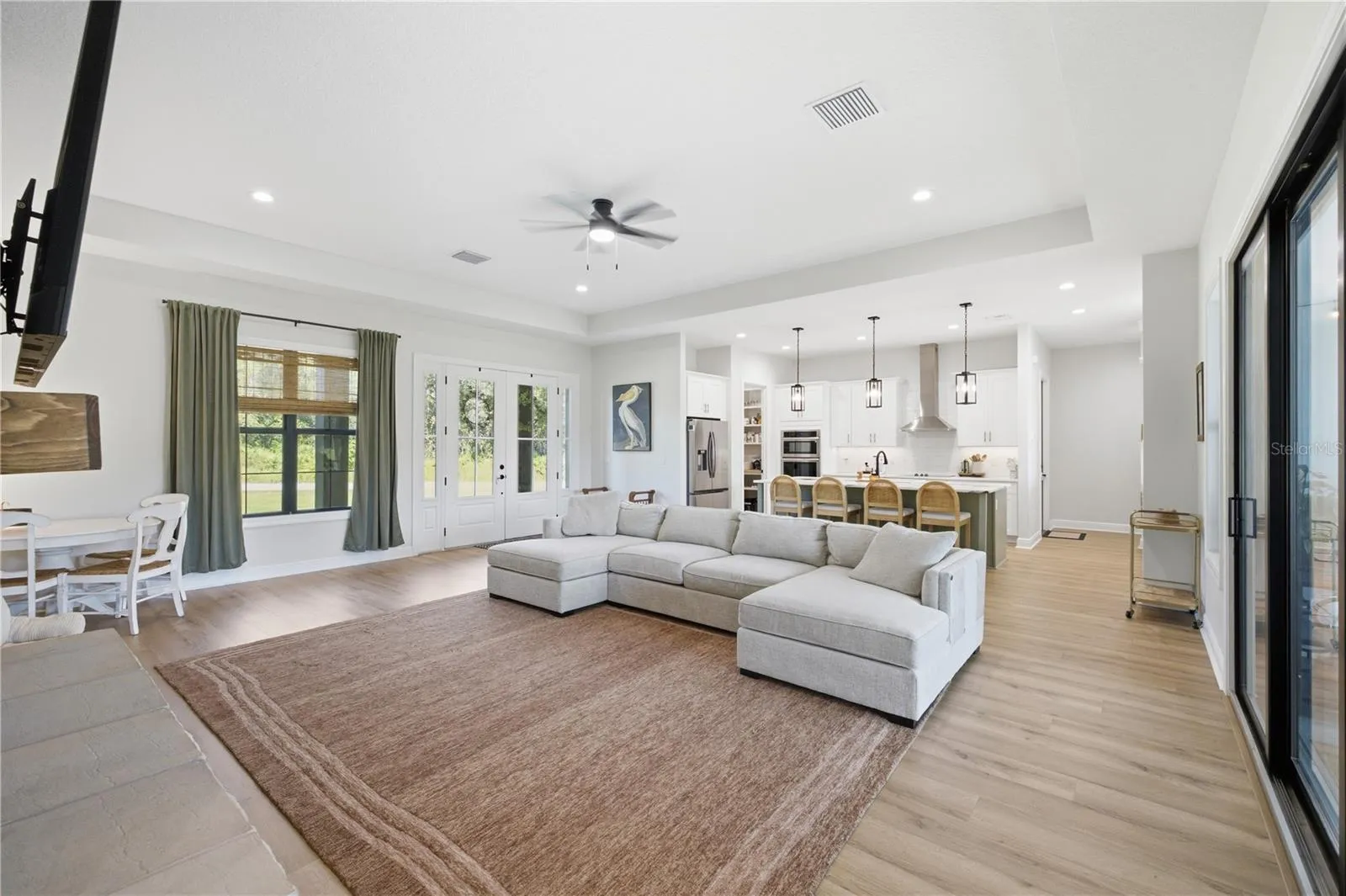 12 FT Tray Ceiling in the Great Room and Black Framed interior and exterior double pane windows.