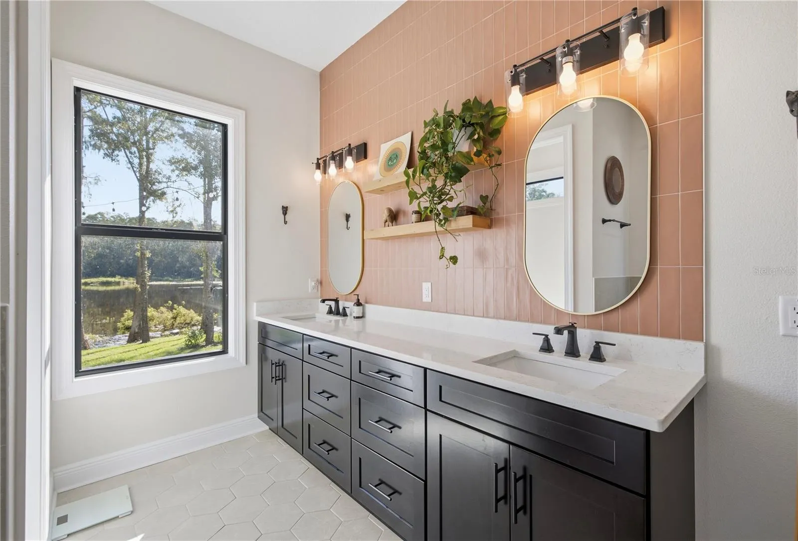 Ceramic tile backsplash all the way up the wall to ceiling in primary bathroom.