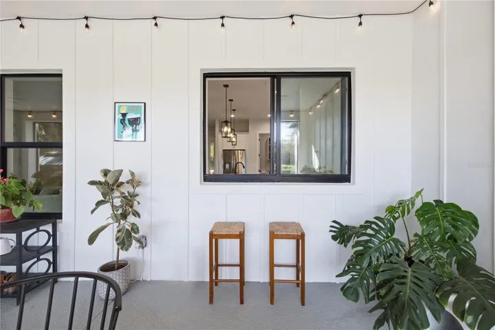 Pass through window from kitchen to rear porch for entertainment nad hosting.