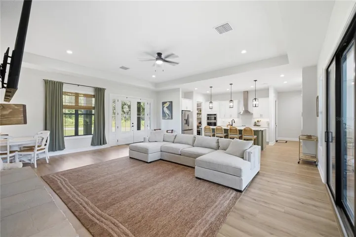 12 FT Tray Ceiling in the Great Room and Black Framed interior and exterior double pane windows.