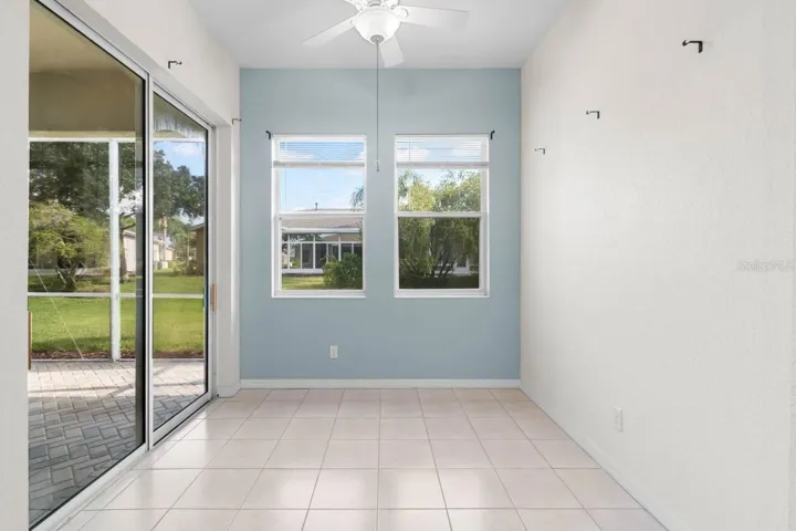 Enclosed dining room perfect transitional space.