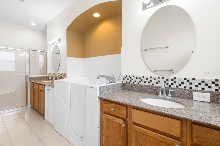 Dual sinks, shower and tub in the Master bath