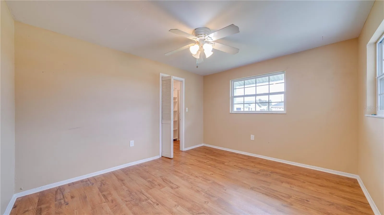 Bedroom No. 2 also features a walk-in closet and LVT flooring.