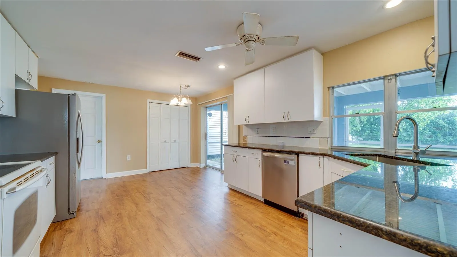 Notice the large pantry and abundant cabinetry.