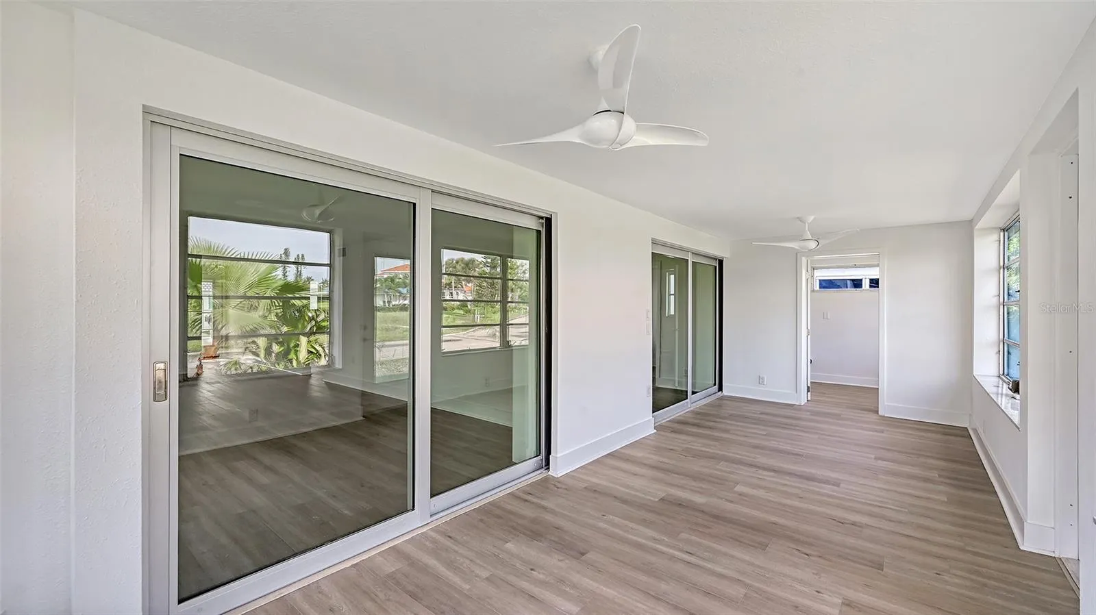 Lanai off Living Area and Primary Bedroom.