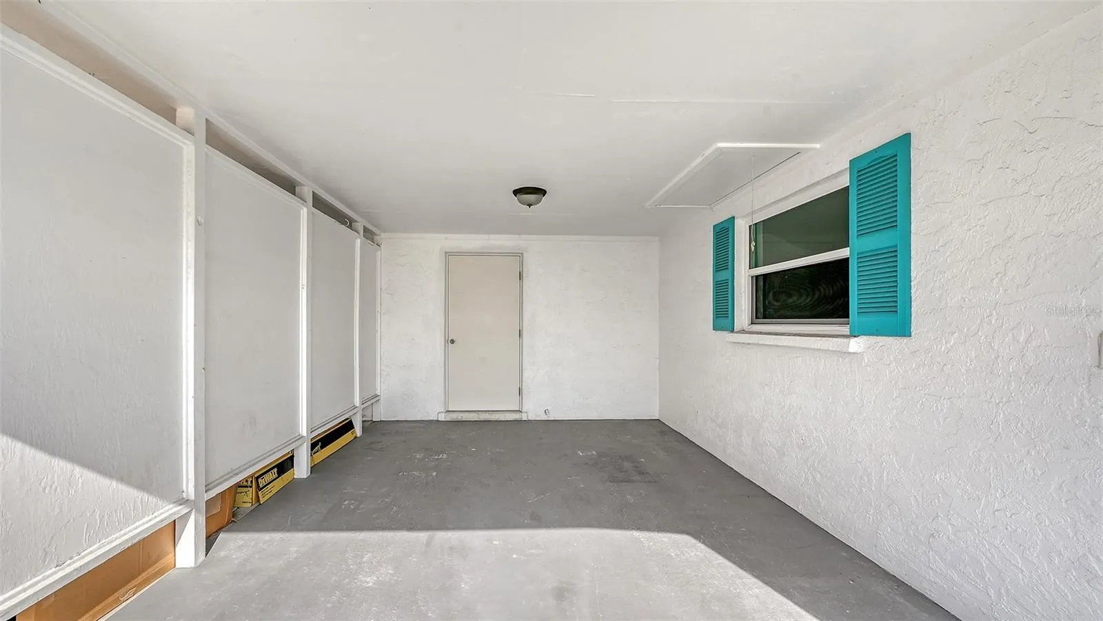 Carport with storage room.