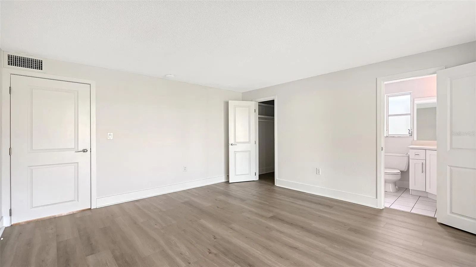 Primary Bedroom (bedroom one) with ensuite bathroom and walk-in closet.