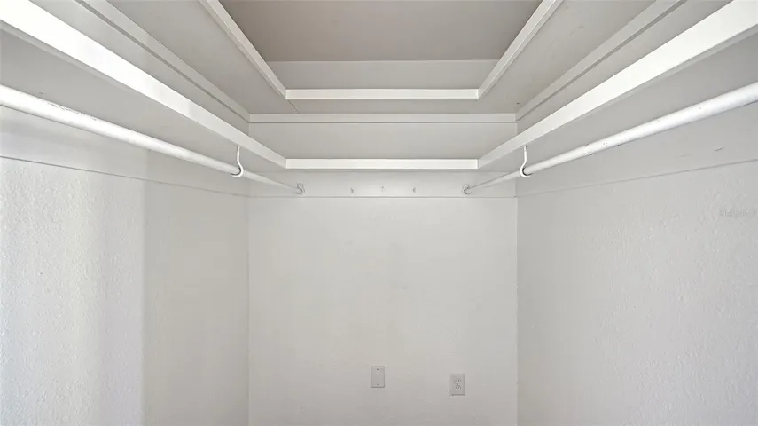 Primary Bedroom (bedroom one) walk-in closet.