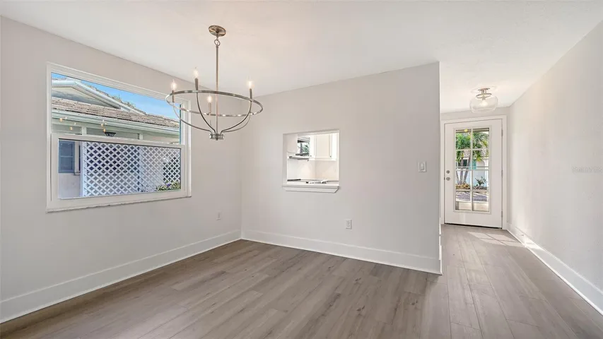 The entry door, Kitchen on the left, Dining Room.