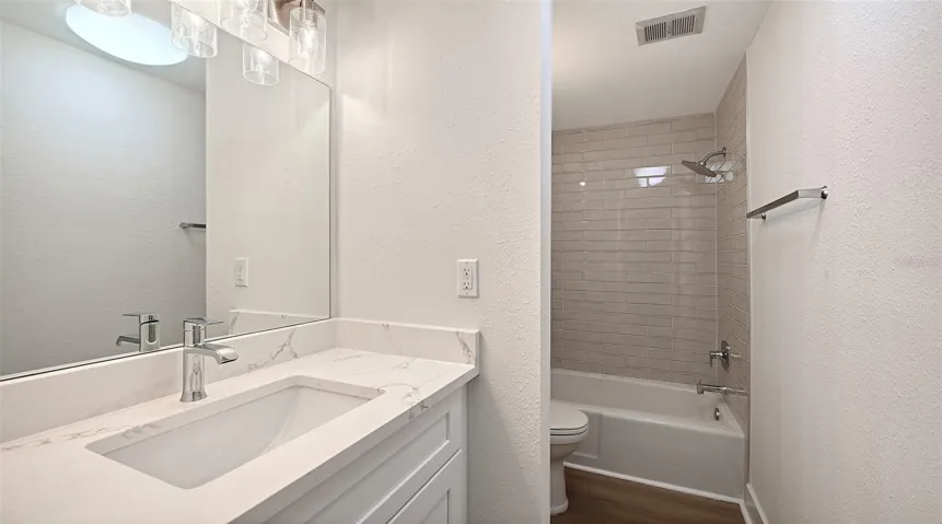 Guest Bathroom with tub/shower combination.