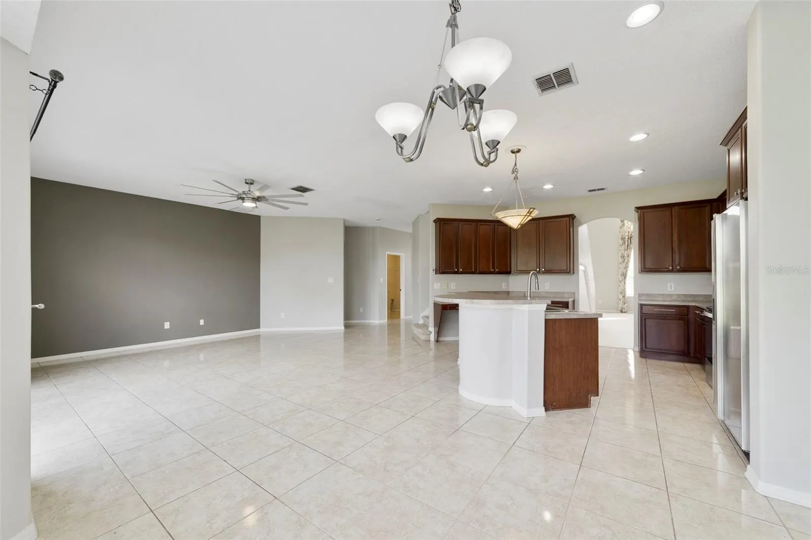 Stainless steel appliances and a SUNNY BREAKFAST NOOK with a bay window overlooking the backyard, complete this inviting space.