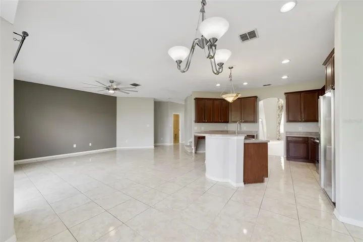 Stainless steel appliances and a SUNNY BREAKFAST NOOK with a bay window overlooking the backyard, complete this inviting space.