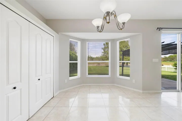 Stainless steel appliances and a SUNNY BREAKFAST NOOK with a bay window overlooking the backyard, complete this inviting space.