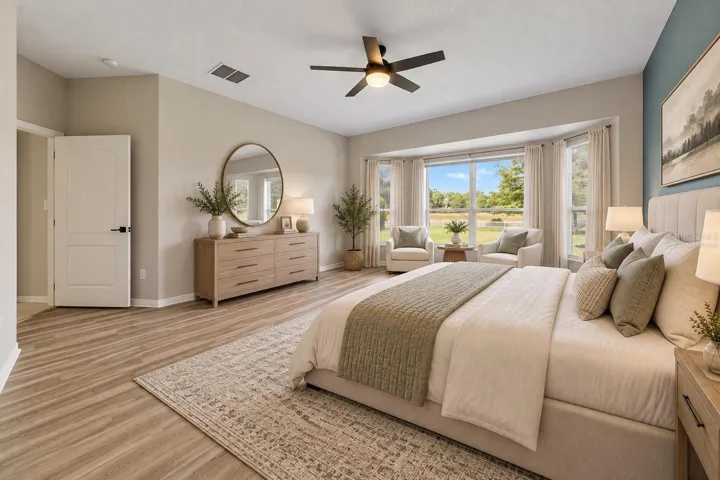 The FIRST-FLOOR PRIMARY SUITE presents a private retreat with LVP FLOORING and a bay window that fills the room with NATURAL LIGHT. Virtually Staged