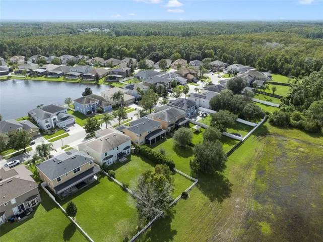 Aerial view of the back of the home and community.