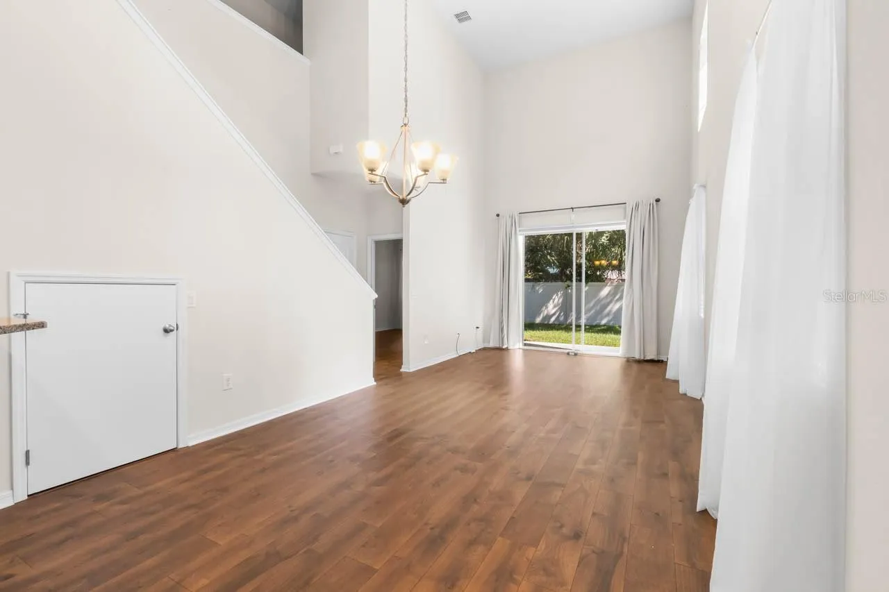 Living and Dining area. Also Storage Under the Stairs
