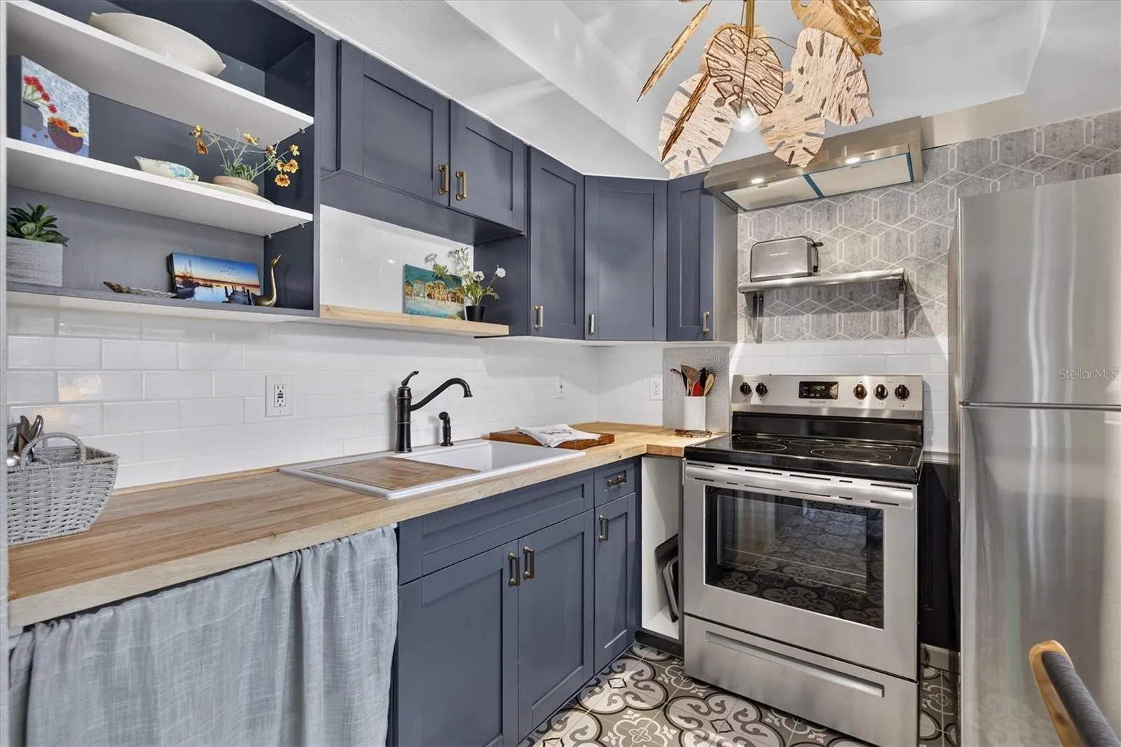 Painted cabinets and newer appliances.