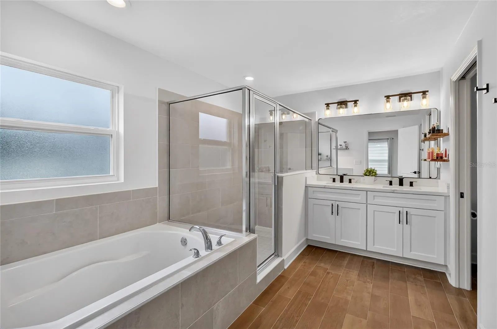 Ensuite bath has walk-in shower and tub which is hard to find these days in new construction