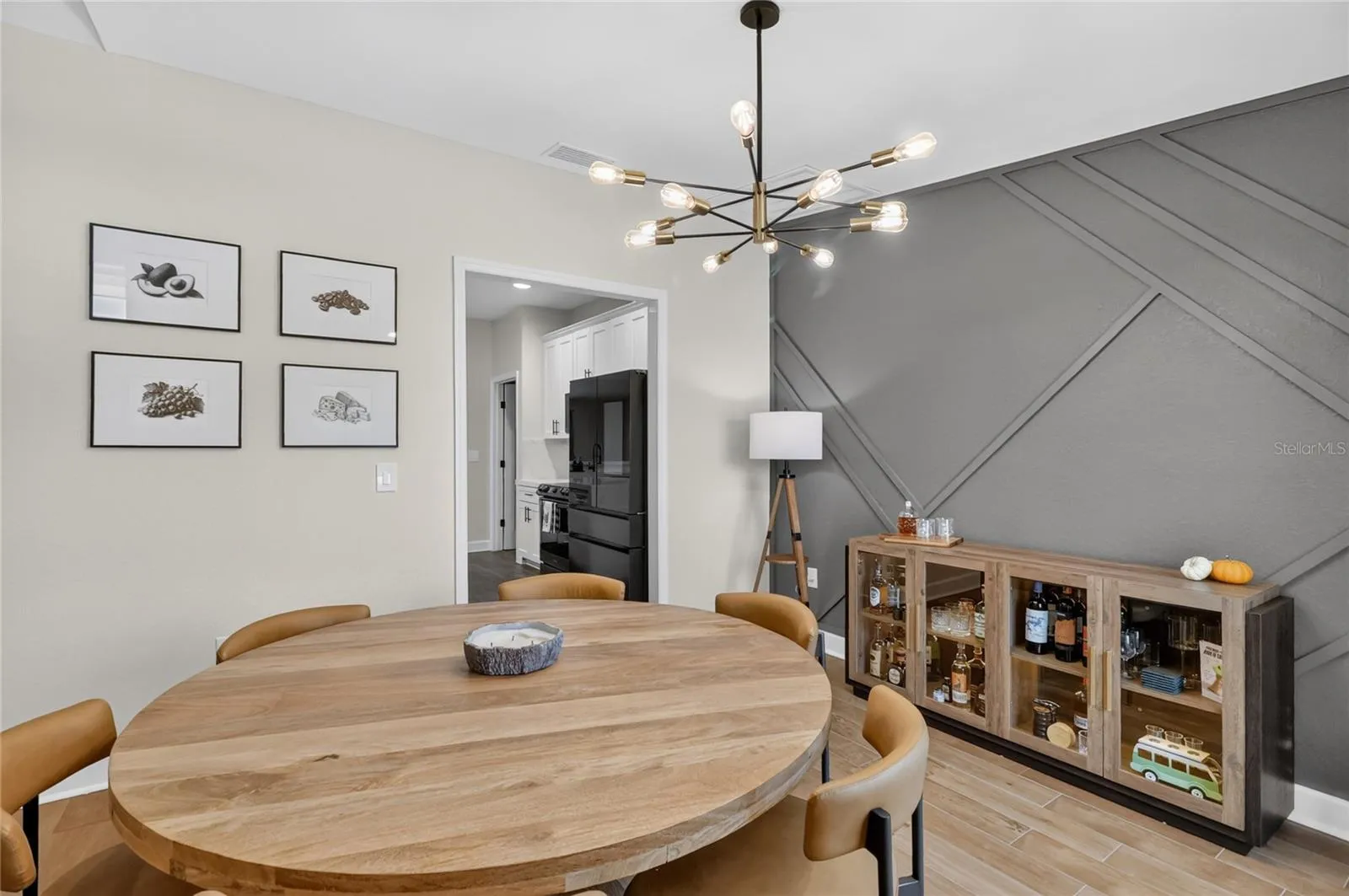 Plenty of room for a larger dining room table. Look at that upgraded light fixture