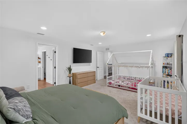Room for a king size bed, toddler bed and crib in the primary bedroom