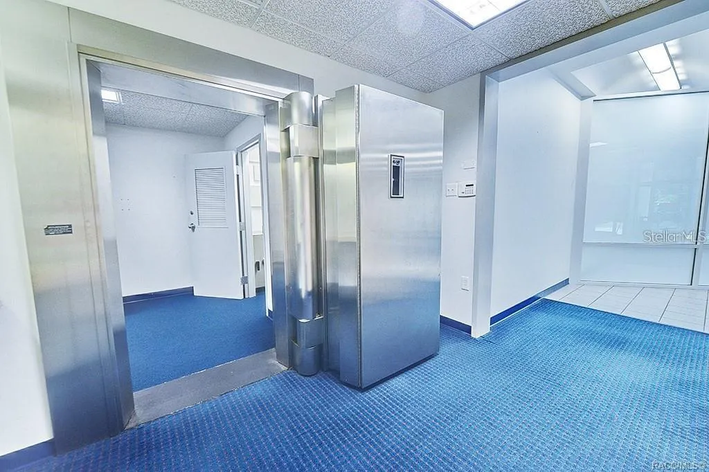 Existing vault entrance and adjoining interior space.