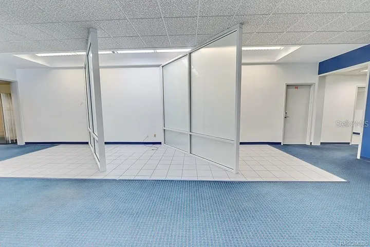 Interior view showing the open area and existing office partitions.