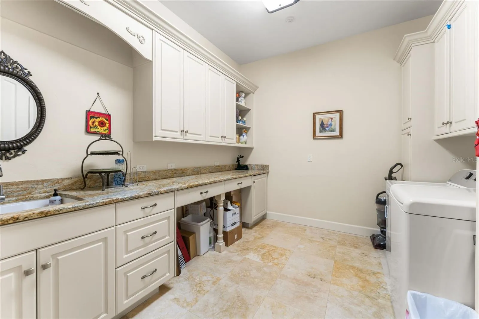Laundry room with sink and shelving