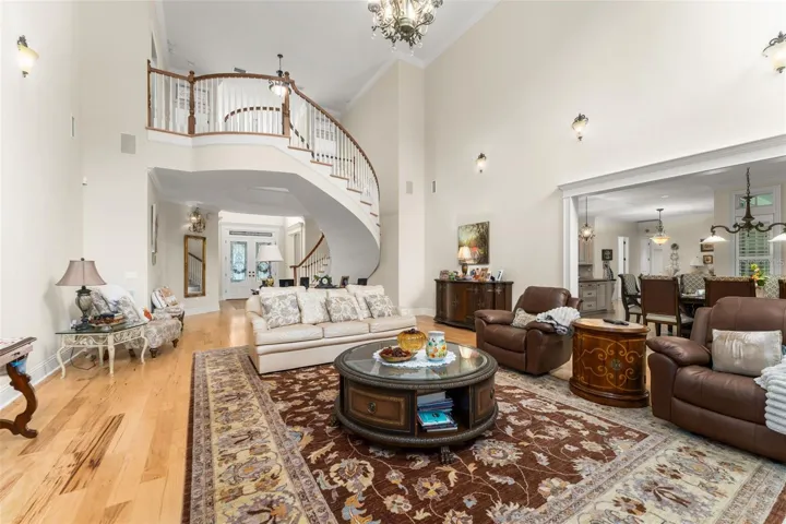 Family room looking back towards foyer &amp; floating staircase