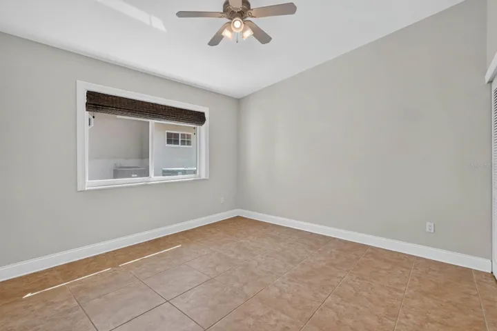 Bright Bedroom With Tile Flooring