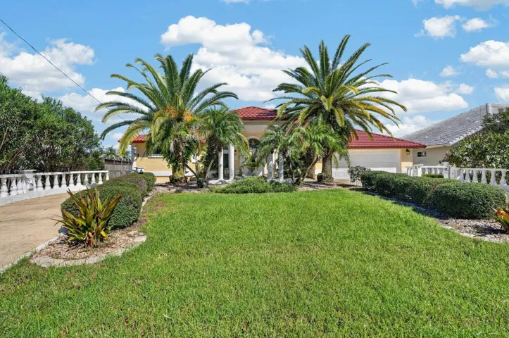 Welcoming Entrance with Tropical Landscaping