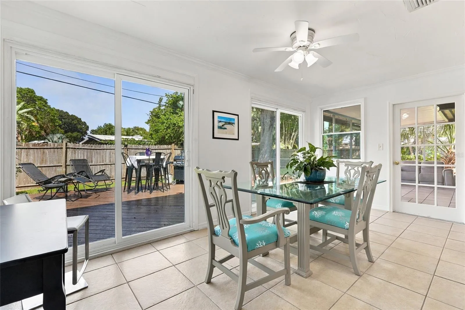 Dining Area Featuring an Updated Sliding Glass Door with Direct Access to the Porch