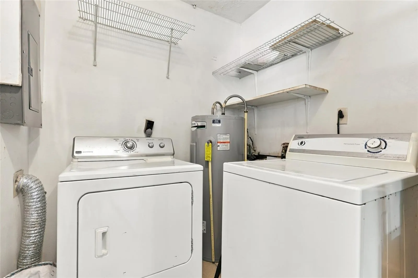 Convenient Indoor Laundry Room with Dedicated Space for Everyday Essentials
