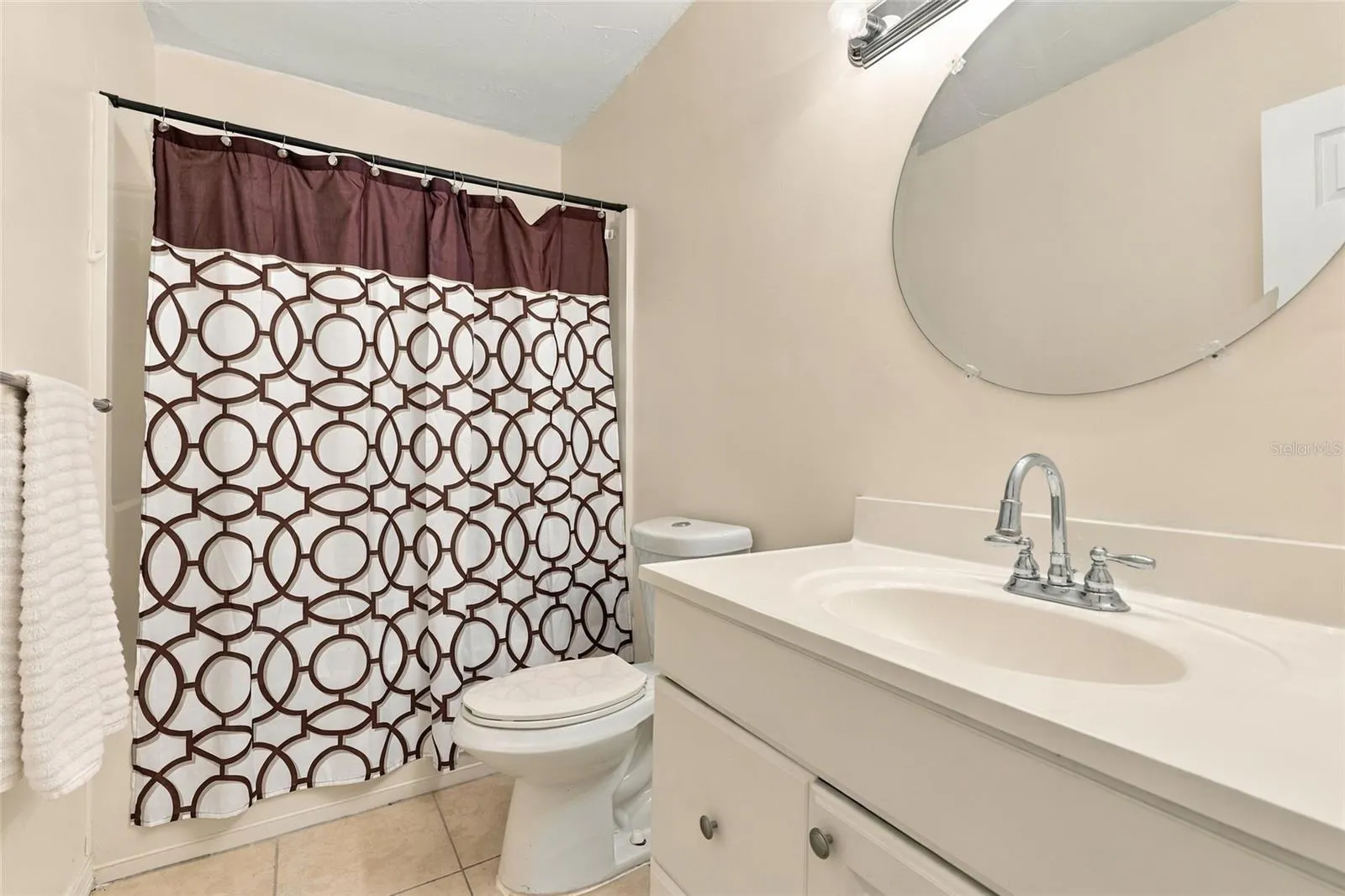 Secondary Bathroom Featuring a Convenient Tub and Shower Combination
