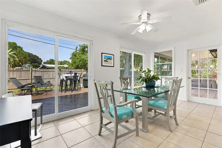 Dining Area Featuring an Updated Sliding Glass Door with Direct Access to the Porch