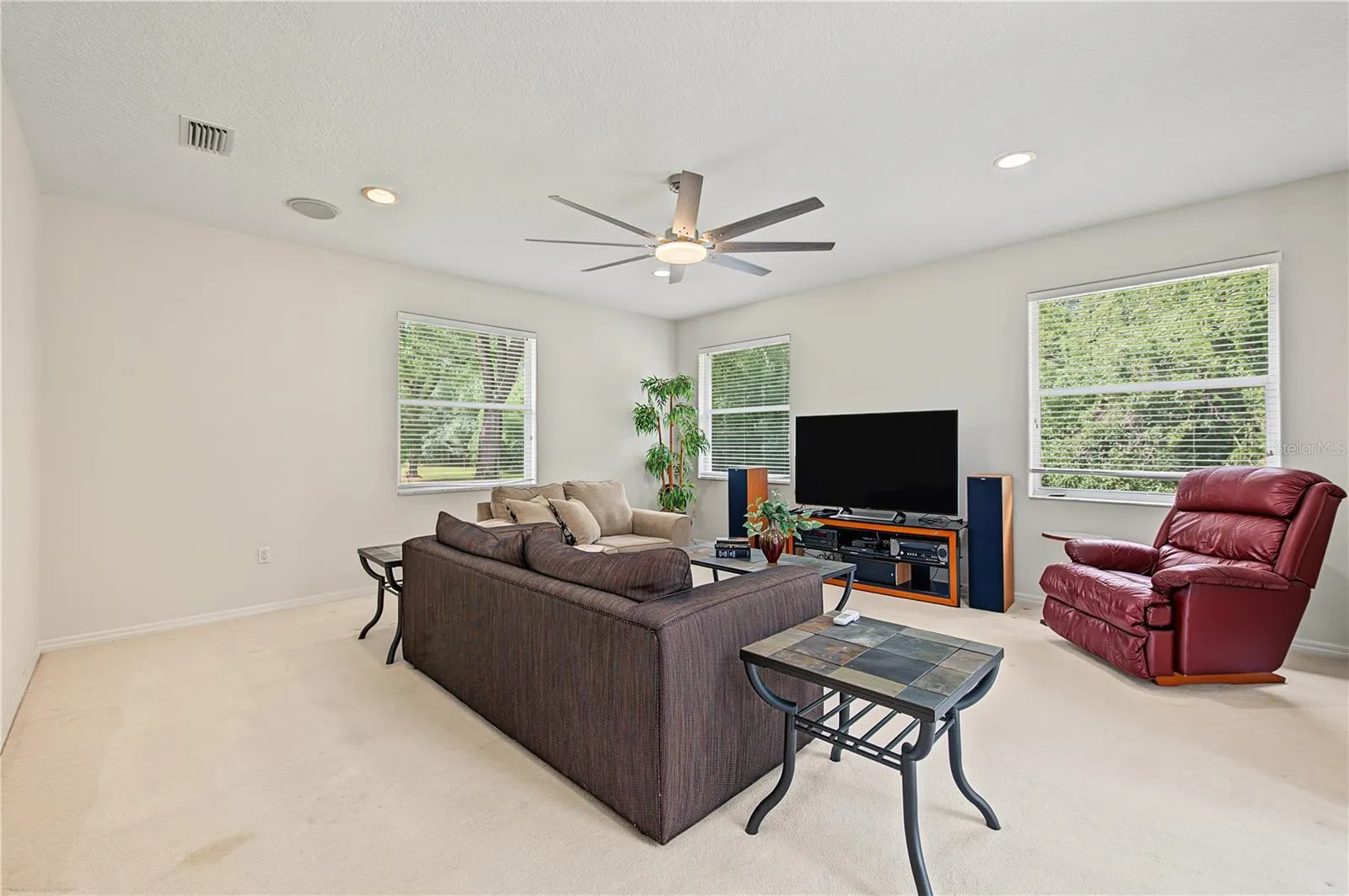 Oversized Family Room, with new ceiling fan and sliding doors to the back yard.