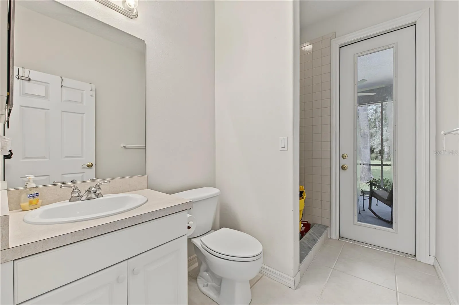 Guest Bathroom with door to the rear patio