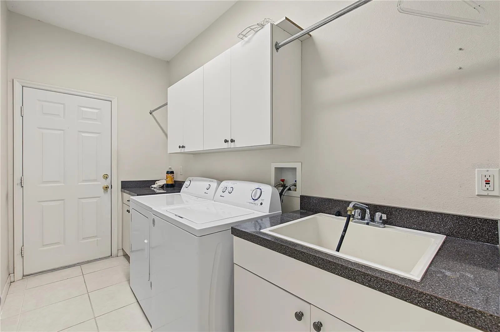 Laundry room and sink coming in from the garage.