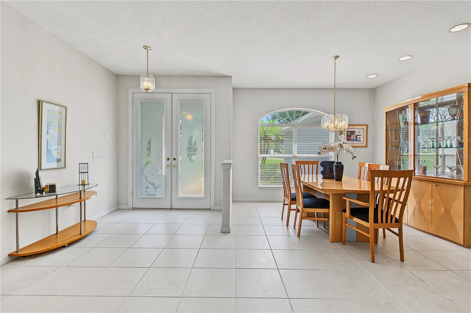 Dining Room area with lots of sunlight open to the foyer and the Living Room.