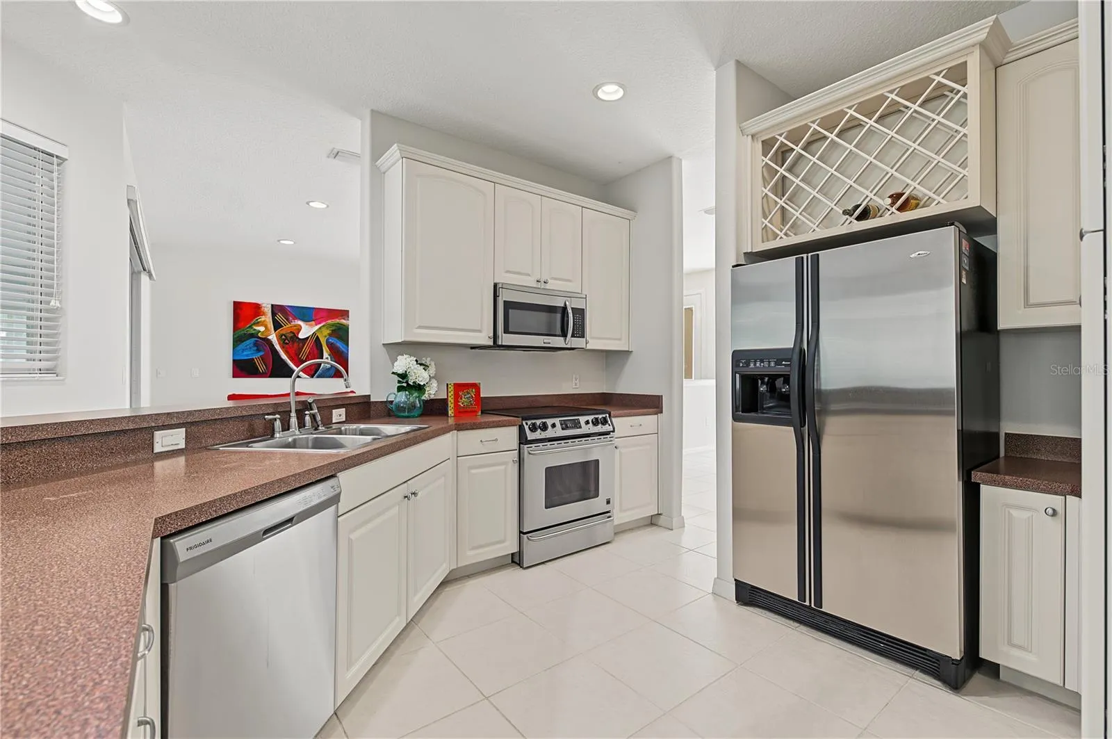 Open Kitchen to the Living Room and Family Room, stainless steel appliances.