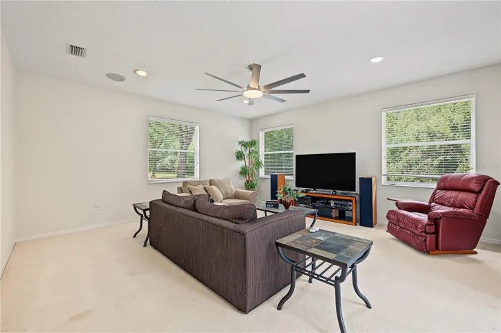 Oversized Family Room, with new ceiling fan and sliding doors to the back yard.