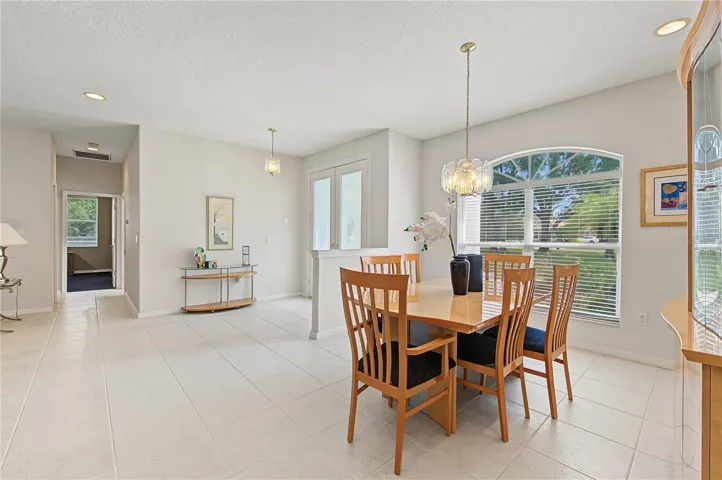 Dining Room area with lots of sunlight and open to the foyer and Living Room.