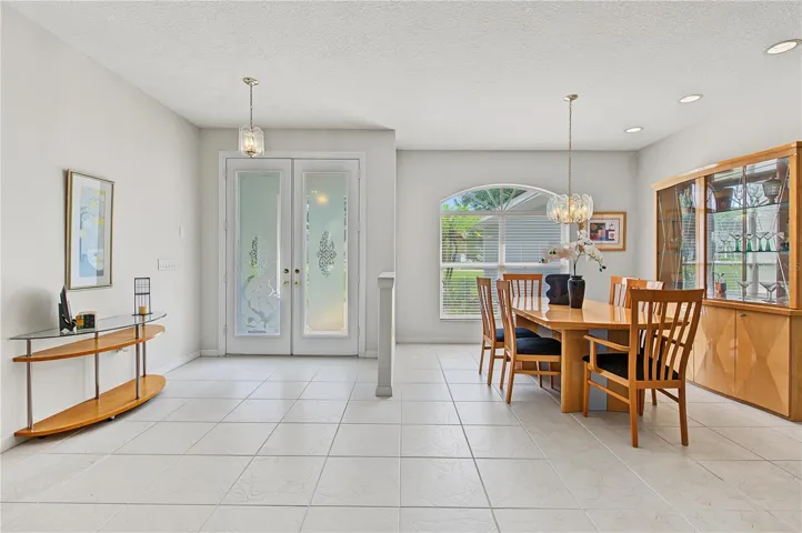 Dining Room area with lots of sunlight open to the foyer and the Living Room.