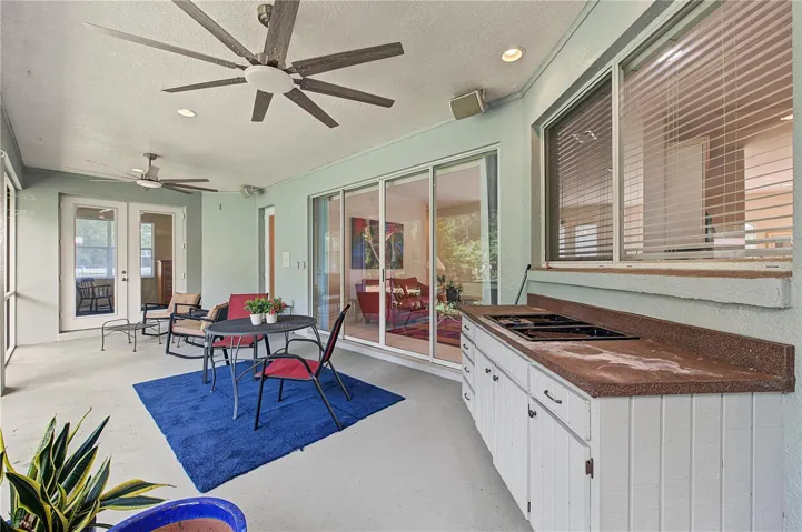 Back Porch with new ceiling fans - French doors off of the master Bedroom