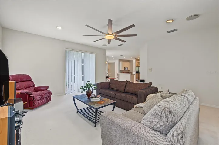 Oversized Family Room, with new ceiling fan and sliding doors to the back yard.