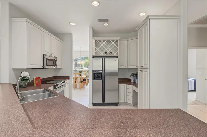Open Kitchen to the Living Room and Family Room, stainless steel appliances.