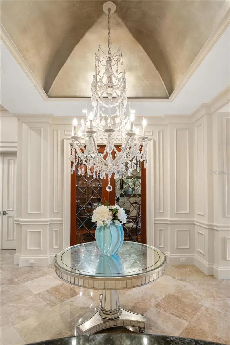Elegant, High-End Light Fixtures throughout. Here is a Unique Chandelier with Gold Leaf Dome