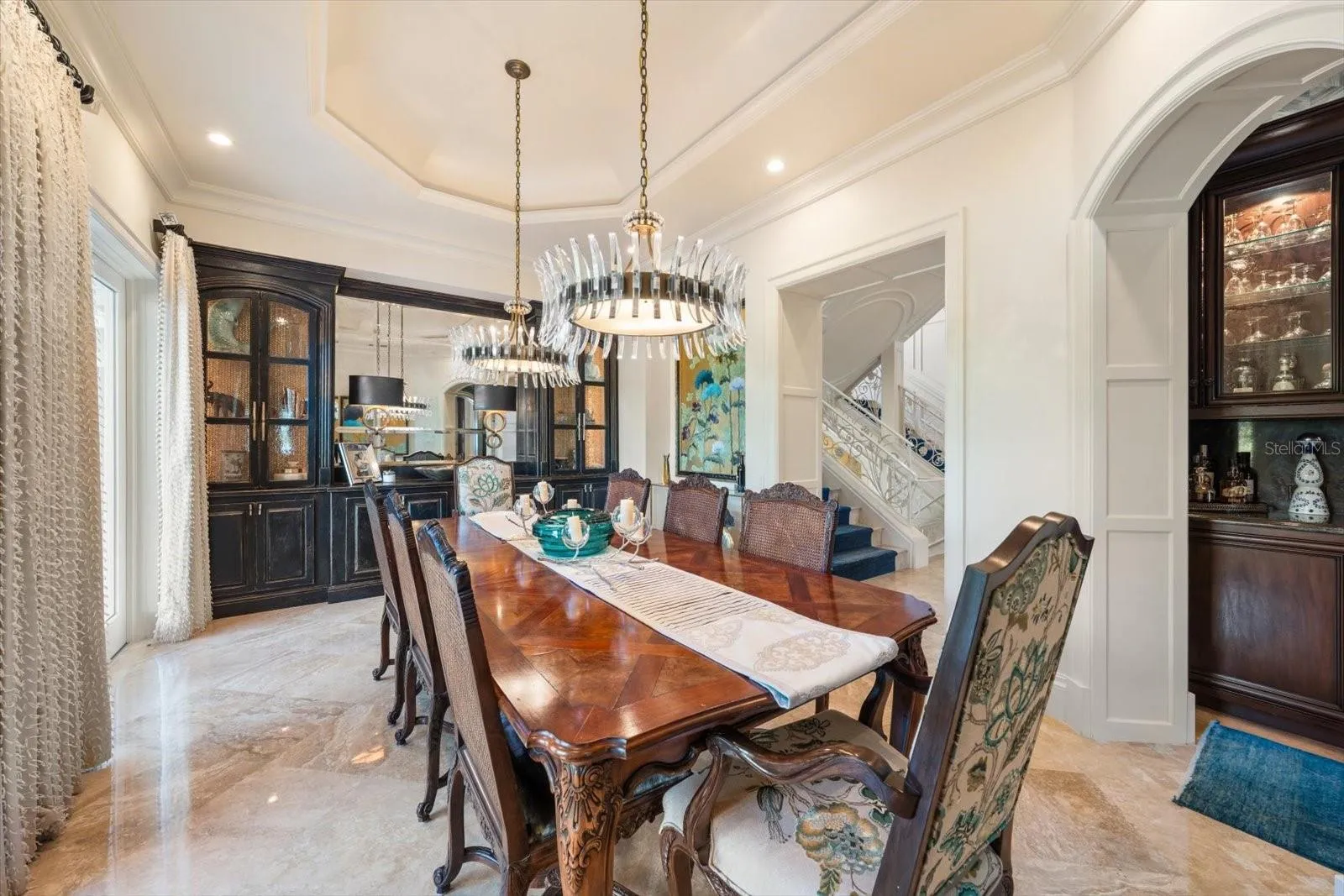 Illuminated Tray Ceiling, Statement Chandeliers &amp; Arched Doorways