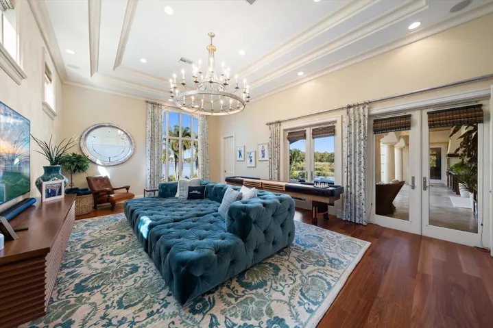 Jaw-Dropping Family Room with Double French Doors leading outside &amp; Built in Murphy Bed