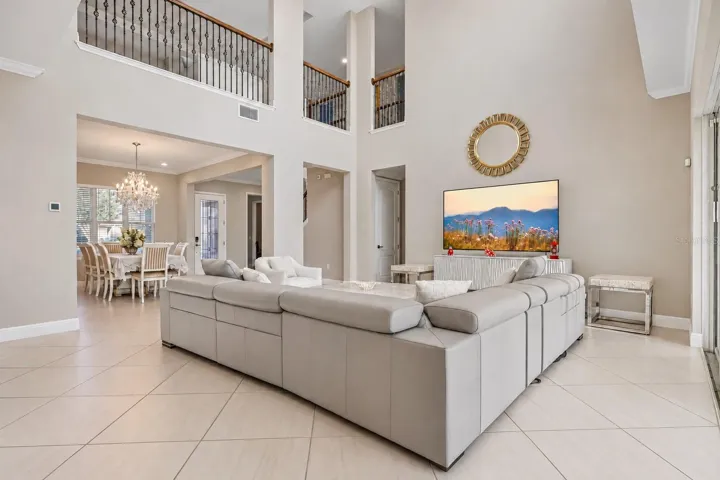 Two story living room with views of the catwalk.
